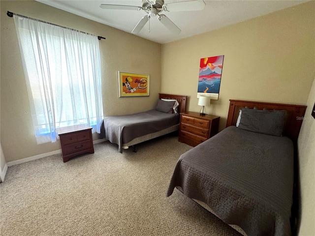 8809 Dunes Ct Unit 201, Kissimmee, FL 34747 - carpeted bedroom featuring multiple windows, baseboards, and a ceiling fan