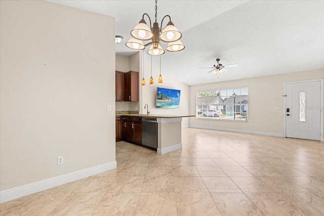 1208 Roma Ct, Orlando, FL 32825 - kitchen with vaulted ceiling, stainless steel dishwasher, a peninsula, a textured ceiling, and open floor plan