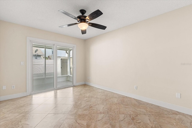 1208 Roma Ct, Orlando, FL 32825 - unfurnished room featuring baseboards, a ceiling fan, marble finish floor, and a textured ceiling