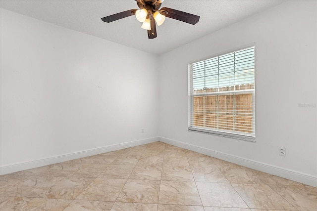 1208 Roma Ct, Orlando, FL 32825 - spare room featuring marble finish floor, baseboards, and ceiling fan