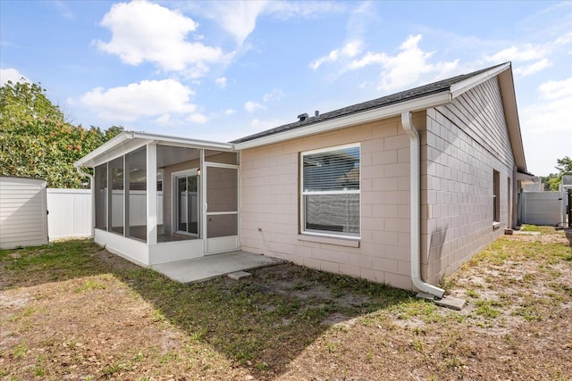 1208 Roma Ct, Orlando, FL 32825 - rear view of property featuring fence and a sunroom