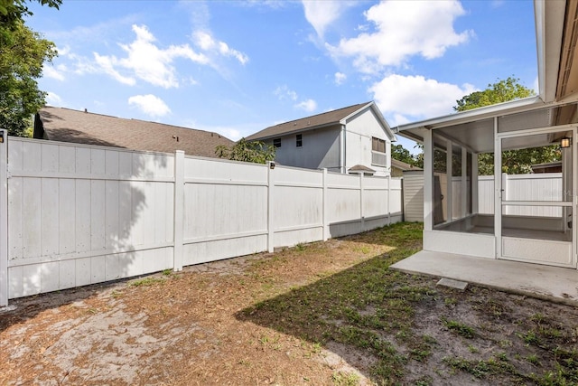 1208 Roma Ct, Orlando, FL 32825 - view of yard featuring a sunroom and fence