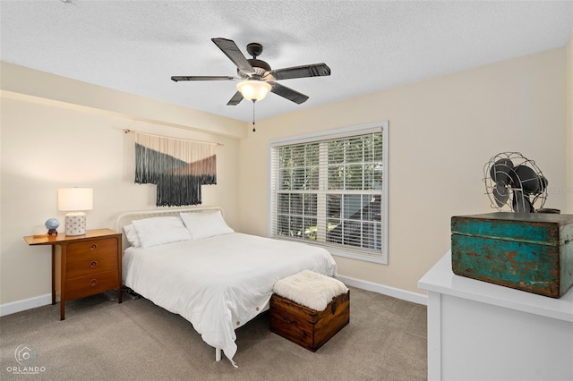 4820 Conway Rd Unit 130, Orlando, FL 32812 - carpeted bedroom with baseboards, a textured ceiling, and ceiling fan