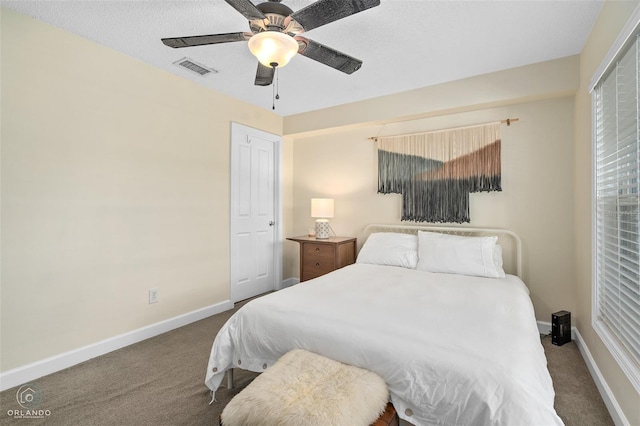 4820 Conway Rd Unit 130, Orlando, FL 32812 - bedroom featuring carpet floors, baseboards, and ceiling fan