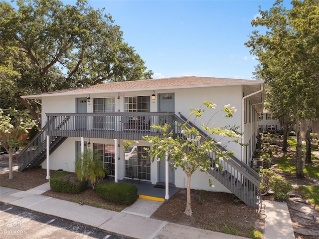 4820 Conway Rd Unit 130, Orlando, FL 32812 - multi unit property with stairway, stucco siding, and a porch