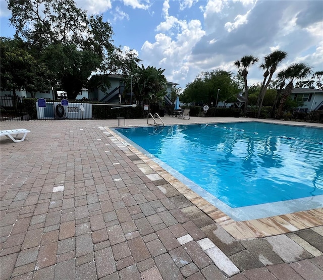 4820 Conway Rd Unit 130, Orlando, FL 32812 - community pool featuring a patio area