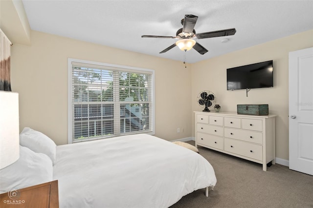4820 Conway Rd Unit 130, Orlando, FL 32812 - carpeted bedroom featuring baseboards and a ceiling fan