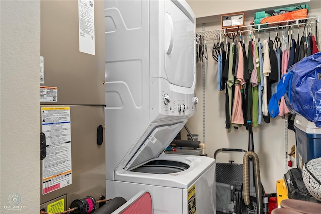 4820 Conway Rd Unit 130, Orlando, FL 32812 - washroom with stacked washer / dryer and water heater