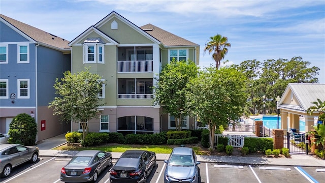 3344 Corona Village Way Unit 207, Orlando, FL 32835 - view of building exterior with uncovered parking