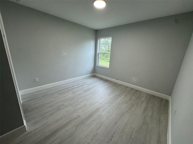 6935 Dickinson Dr, Sebring, FL 33872 - spare room with baseboards and wood finished floors