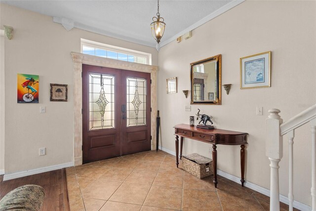 2005 Pitch Way, Kissimmee, FL 34746 - foyer entrance with crown molding, baseboards, and french doors