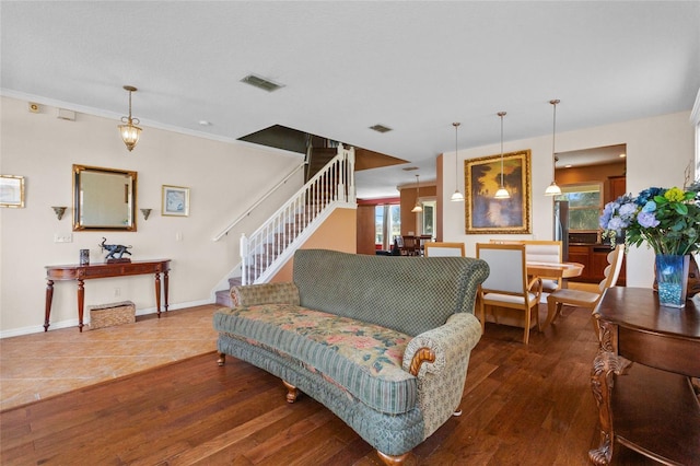 2005 Pitch Way, Kissimmee, FL 34746 - living area with baseboards, wood-type flooring, stairs, and visible vents
