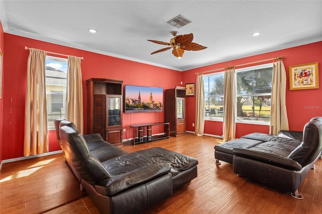 2005 Pitch Way, Kissimmee, FL 34746 - living area with visible vents, ornamental molding, ceiling fan, and hardwood / wood-style flooring