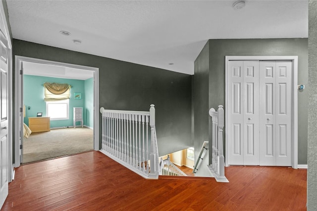 2005 Pitch Way, Kissimmee, FL 34746 - corridor featuring baseboards, wood finished floors, and an upstairs landing