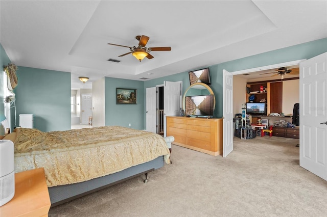 2005 Pitch Way, Kissimmee, FL 34746 - carpeted bedroom featuring a ceiling fan, a tray ceiling, and visible vents