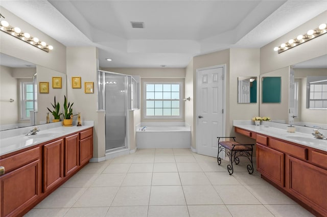 2005 Pitch Way, Kissimmee, FL 34746 - bathroom with visible vents, a bath, two vanities, a sink, and a stall shower