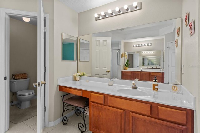 2005 Pitch Way, Kissimmee, FL 34746 - full bath with vanity, tile patterned flooring, a shower stall, and toilet