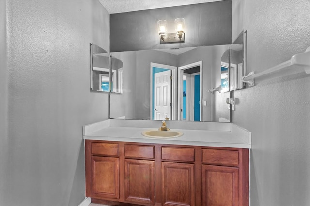 2005 Pitch Way, Kissimmee, FL 34746 - bathroom featuring vanity and a textured wall