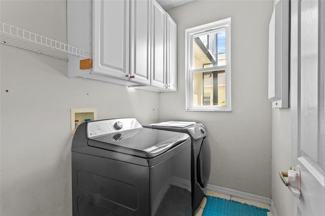 2005 Pitch Way, Kissimmee, FL 34746 - washroom featuring baseboards, tile patterned flooring, cabinet space, and washing machine and dryer
