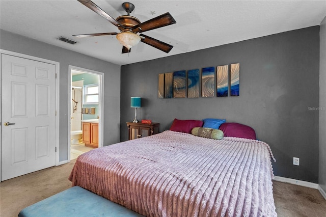 2005 Pitch Way, Kissimmee, FL 34746 - carpeted bedroom featuring visible vents, baseboards, ceiling fan, and ensuite bathroom