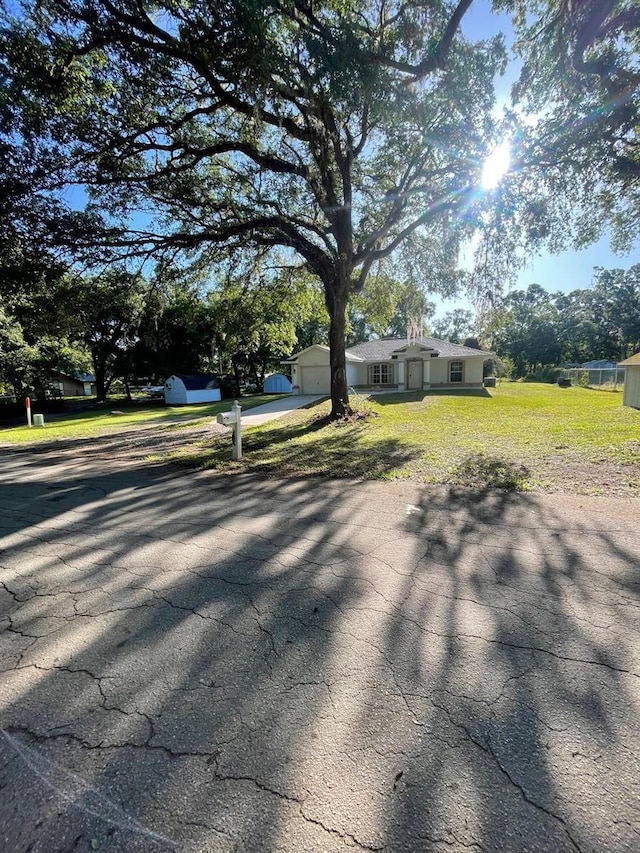 exterior space featuring driveway and a garage
