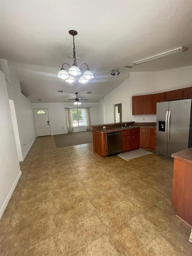 kitchen featuring dark countertops, ceiling fan with notable chandelier, open floor plan, stainless steel refrigerator with ice dispenser, and dishwashing machine