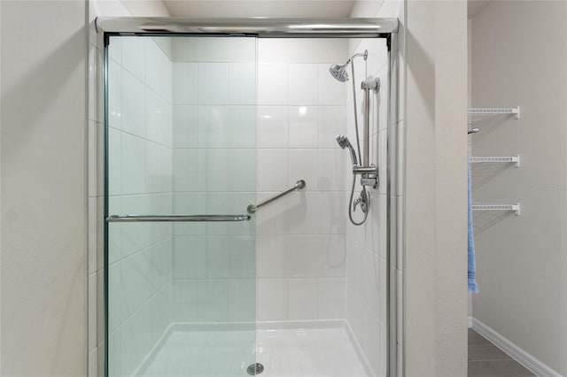 bathroom featuring a shower stall