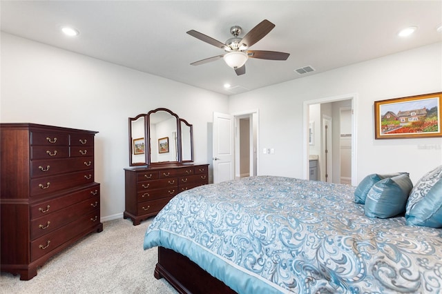 bedroom with light colored carpet, visible vents, ceiling fan, ensuite bathroom, and recessed lighting