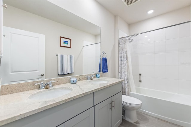 full bathroom with shower / tub combo with curtain, visible vents, toilet, and a sink