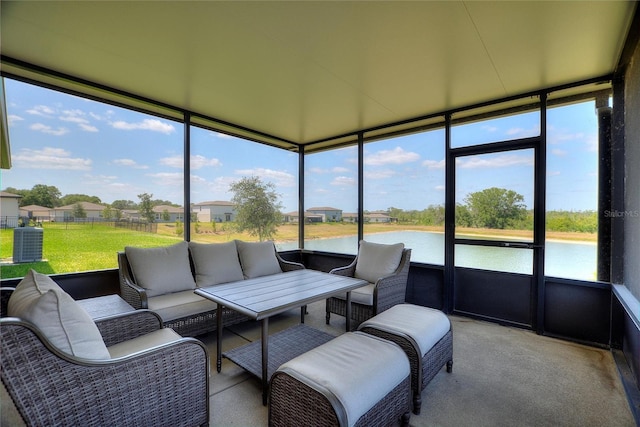sunroom / solarium with a water view and outdoor lounge area