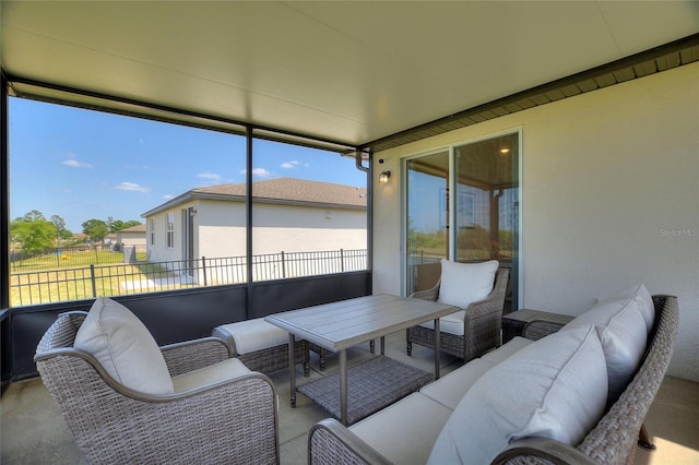sunroom / solarium featuring outdoor lounge area