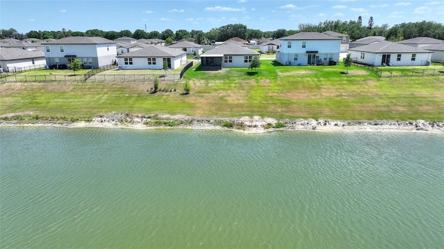 aerial view with a residential view and a water view