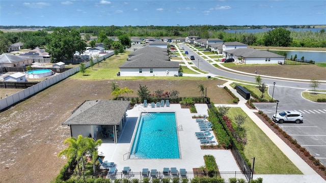 birds eye view of property with a residential view