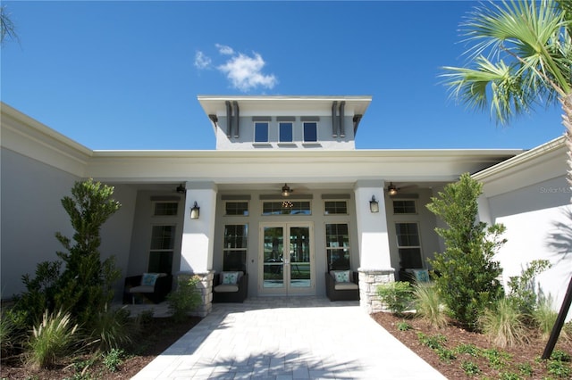 16043 Scarpetta St, Winter Garden, FL 34787 - doorway to property featuring french doors and stucco siding