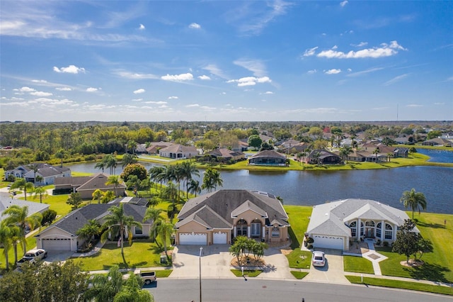 birds eye view of property with a residential view and a water view