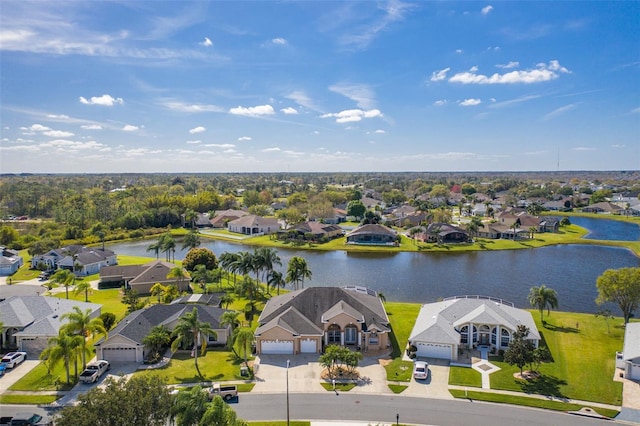 aerial view featuring a residential view and a water view