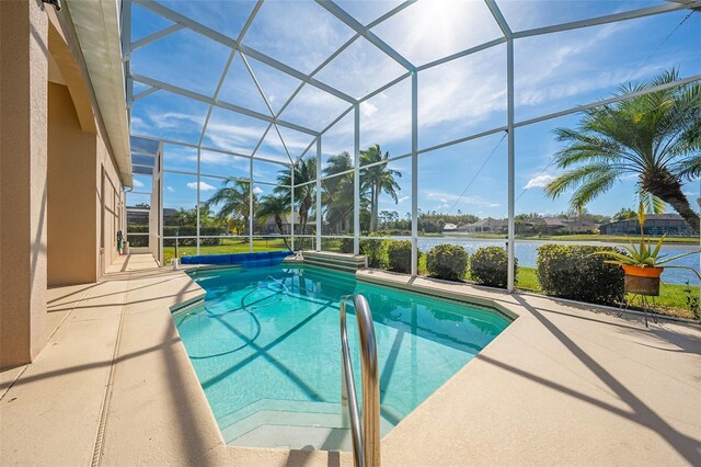 outdoor pool featuring a lanai, a water view, and a patio area