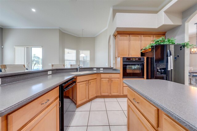 kitchen with light brown cabinetry, ornamental molding, light tile patterned floors, a sink, and black appliances
