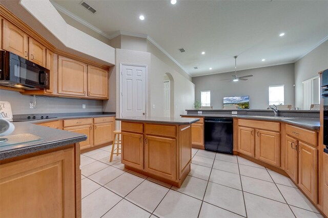 kitchen featuring crown molding, dark countertops, a sink, black appliances, and visible vents
