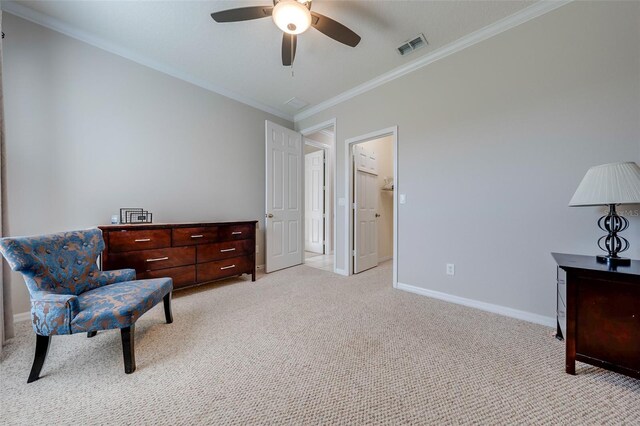 living area featuring baseboards, visible vents, light colored carpet, a ceiling fan, and crown molding