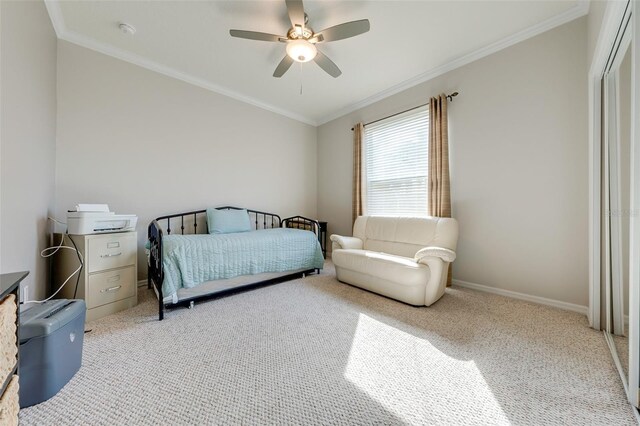 bedroom with light carpet, baseboards, ornamental molding, and ceiling fan