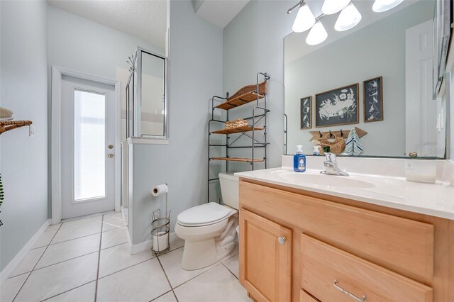 full bath with tile patterned floors, baseboards, a wealth of natural light, and toilet