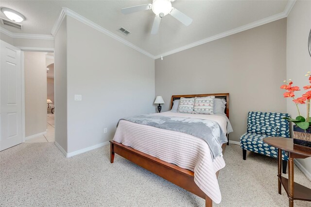 bedroom featuring visible vents, crown molding, and light carpet