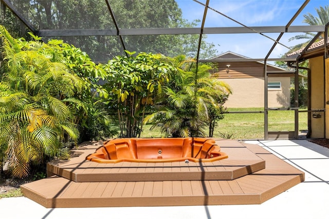 exterior space featuring a lanai and a hot tub