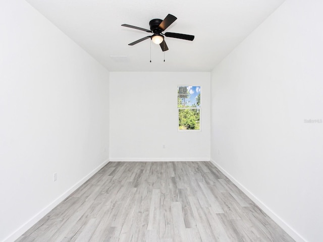 7744 Sun N Lake Blvd, Sebring, FL 33872 - empty room featuring light wood finished floors, baseboards, and a ceiling fan