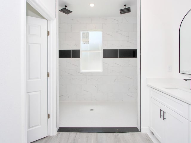 7744 Sun N Lake Blvd, Sebring, FL 33872 - bathroom with wood finished floors, vanity, and a tile shower