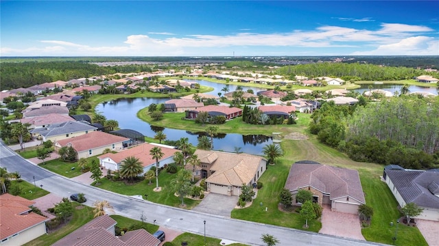 bird's eye view with a water view and a residential view