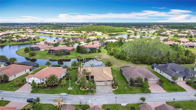 bird's eye view with a water view and a residential view