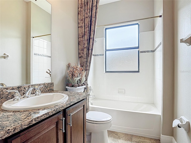 bathroom with vanity, tile patterned floors, shower / bathtub combination, and toilet