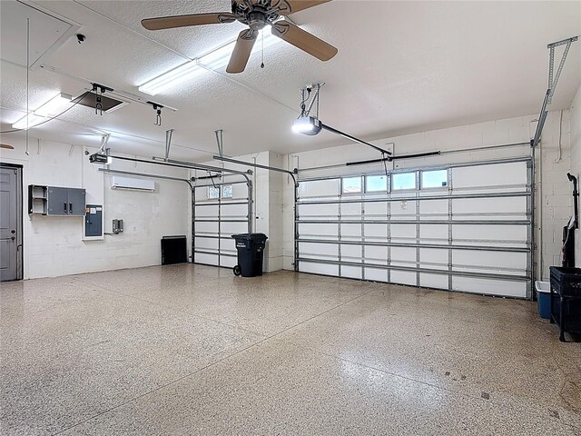 garage with a garage door opener, a ceiling fan, electric panel, and concrete block wall